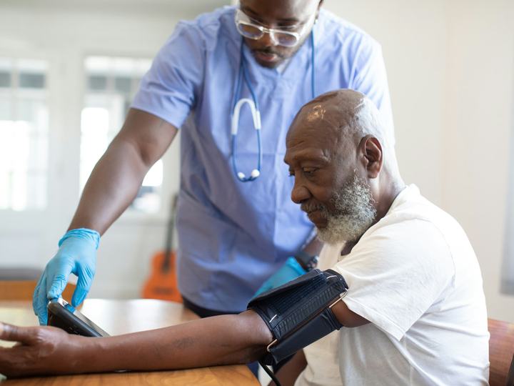 Doctor checking a patient's blood pressure